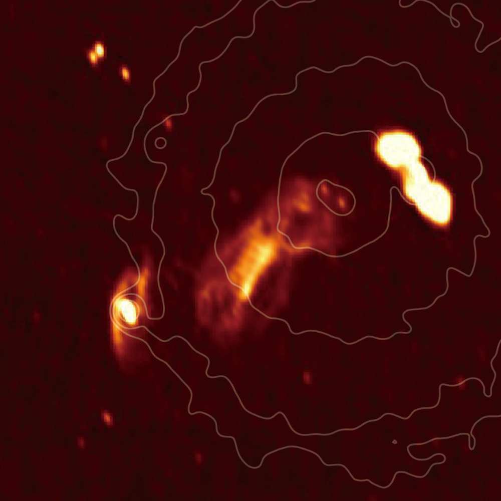 Radio and X-ray composite image of the Hydra Cluster (Abell 1060), showing active galactic nucleus jets, shockwaves, and hot gas bubbles in the intracluster medium.