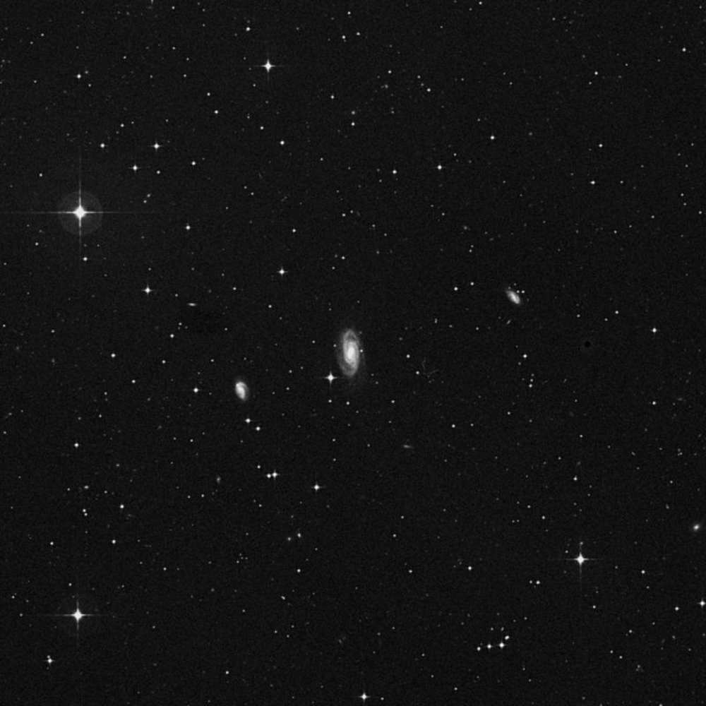 Monochrome deep-sky image of the NGC 1417 Group showing a compact collection of galaxies centered around NGC 1417, including faint spiral and elliptical members.