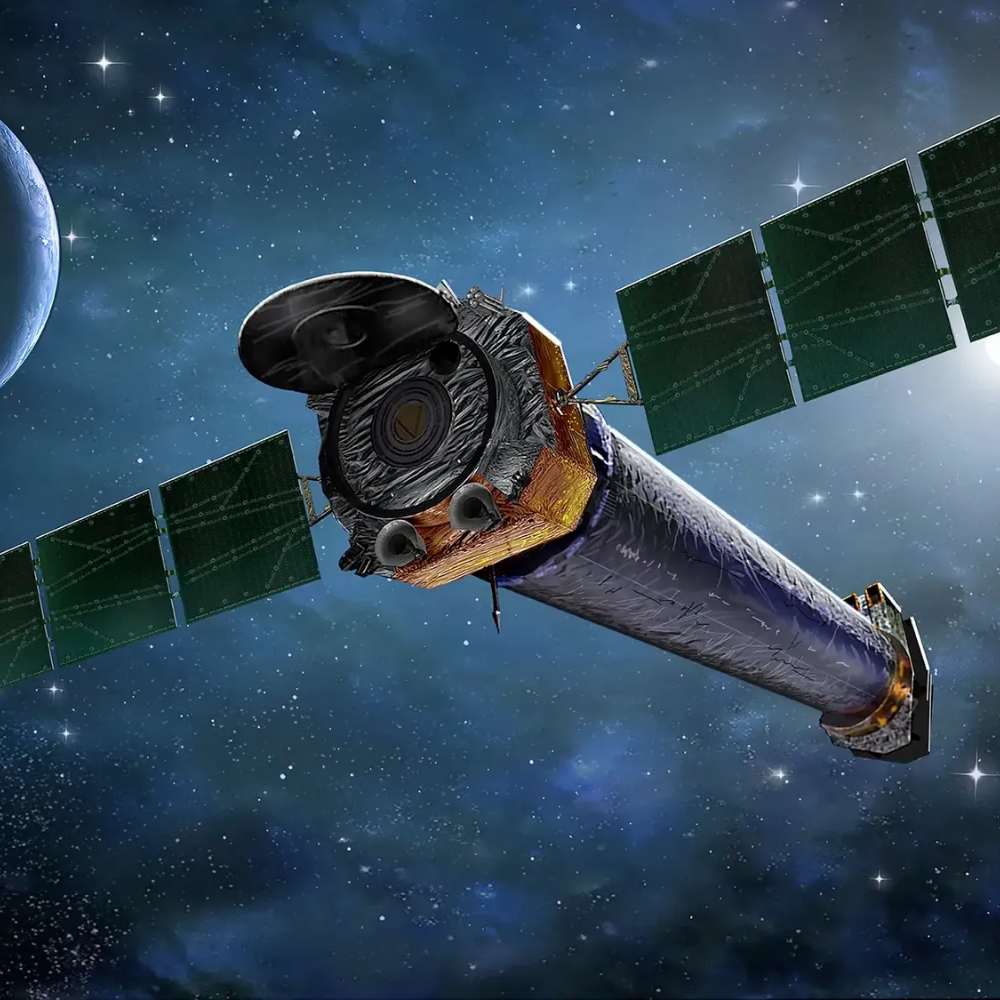 Chandra X-ray Observatory in space observing high-energy cosmic phenomena like black holes, neutron stars, and supernova remnants.