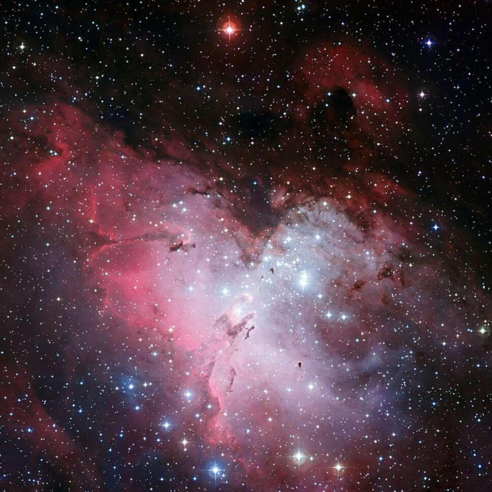 The Eagle Nebula (M16) showing the Pillars of Creation—massive columns of gas and dust in a bright star-forming region of the Serpens constellation.