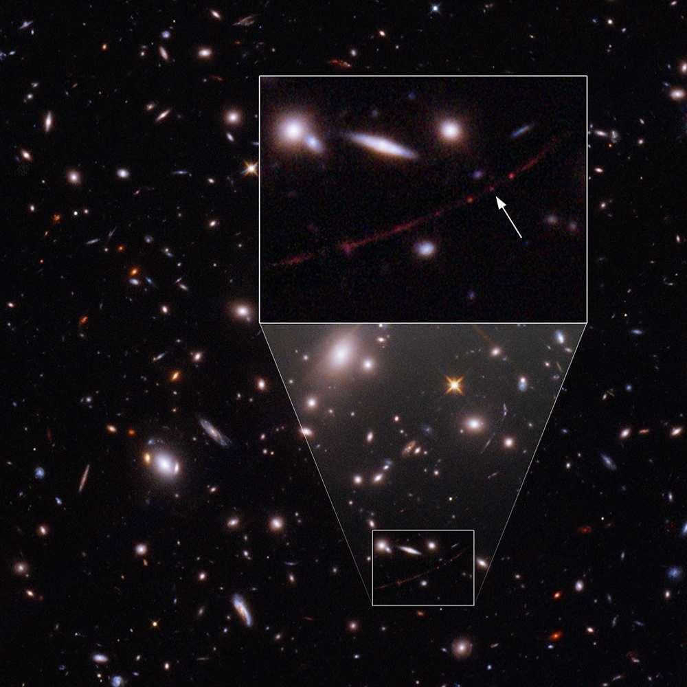 Hubble image showing Earendel, the most distant known star, detected through gravitational lensing in a galaxy magnified by a foreground cluster.