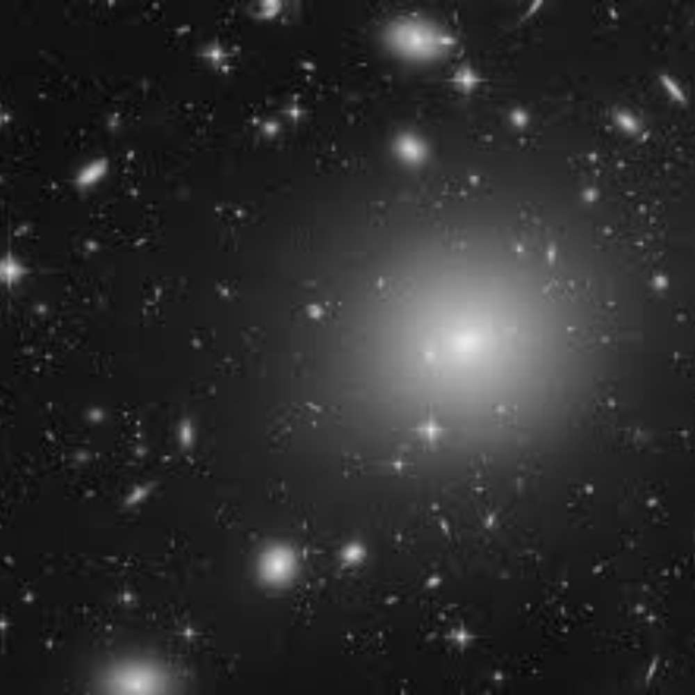 Black and white Hubble image showing dense galaxy clusters in the Shapley Supercluster, one of the most massive structures in the nearby universe.