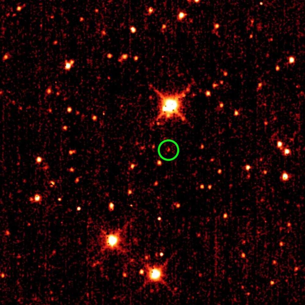 2010 TK7, the first confirmed Earth Trojan asteroid, highlighted near the Sun–Earth L4 Lagrange point in an infrared sky survey image.