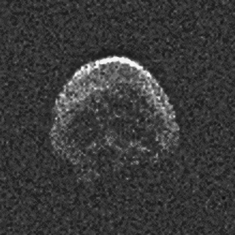 Radar image of near-Earth asteroid 2015 TB145, showing an irregular, cratered surface structure captured during its close flyby of Earth.