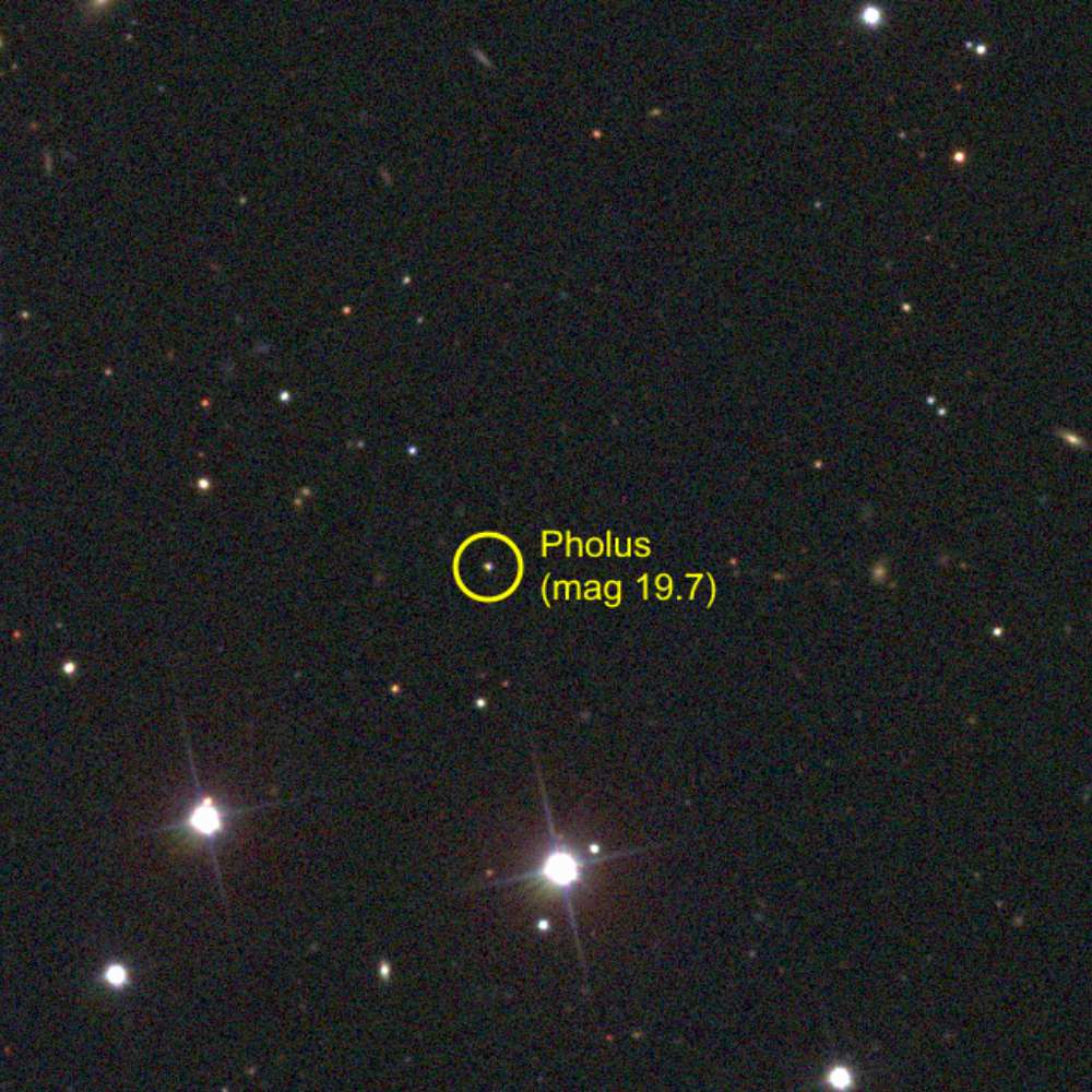5145 Pholus, a Centaur object between Saturn and Neptune, identified in a deep-sky telescope image with its faint magnitude highlighted among background stars.
