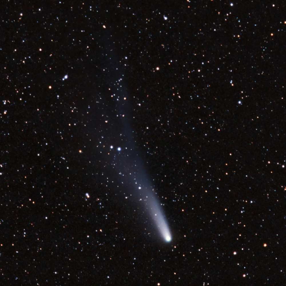 (944) Hidalgo, a transitional Centaur object showing a faint comet-like tail against a dense star field.