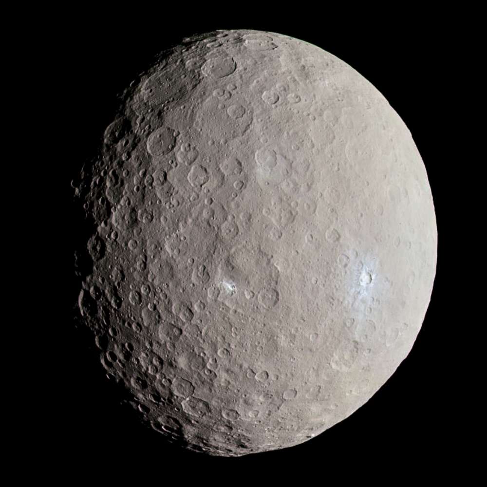 High-resolution image of Ceres showing its cratered surface and bright salt deposits, highlighting the largest object in the asteroid belt and a classified dwarf planet.