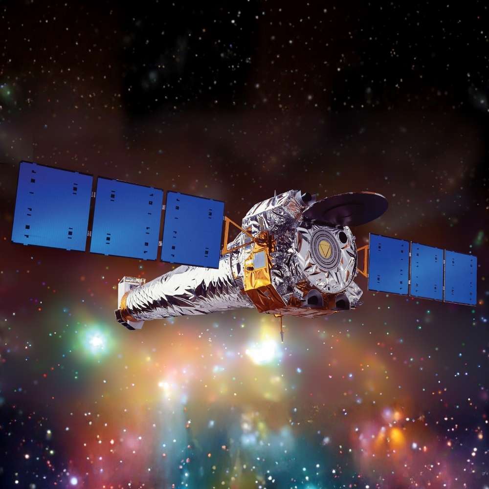 Chandra X-ray Observatory space telescope observing high-energy X-ray sources in deep space including black holes, supernova remnants, and galaxy clusters