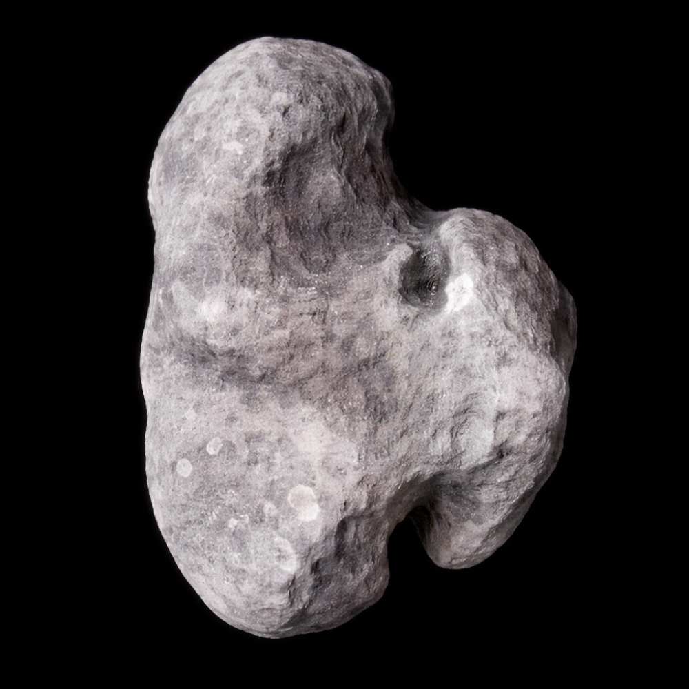 Irregularly shaped moon Hydra orbiting Pluto, showing a bright icy surface with impact craters captured by NASA’s New Horizons spacecraft.