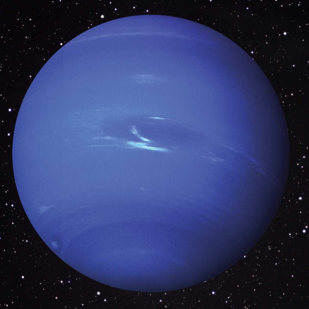 Global view of Neptune, the outermost ice giant planet, showing its deep blue atmosphere, fast-moving clouds, and storm systems observed by Voyager 2.