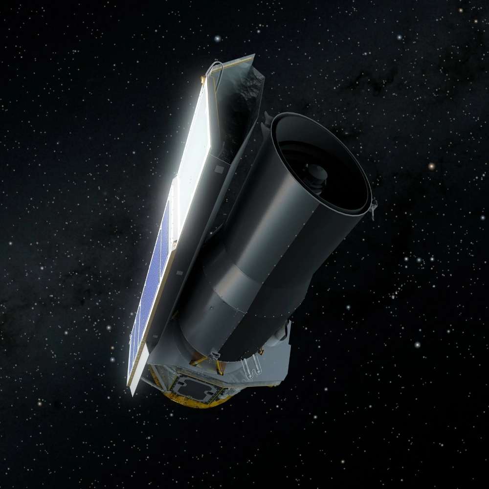 Spitzer Space Telescope operating in deep space, NASA’s infrared observatory designed to study star formation, exoplanets, galaxies, and cold cosmic dust beyond visible wavelengths.