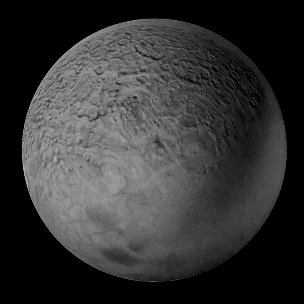 Umbriel, a dark icy moon of Uranus, showing its heavily cratered surface and low albedo as observed by Voyager 2.