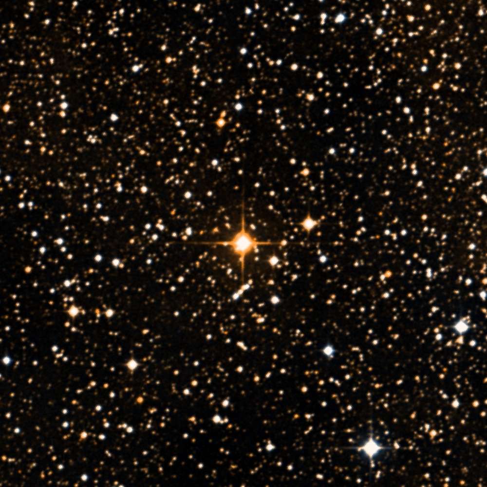 High-resolution star field image showing UY Scuti, a bright red supergiant star, shining among dense background stars in the Scutum constellation.
