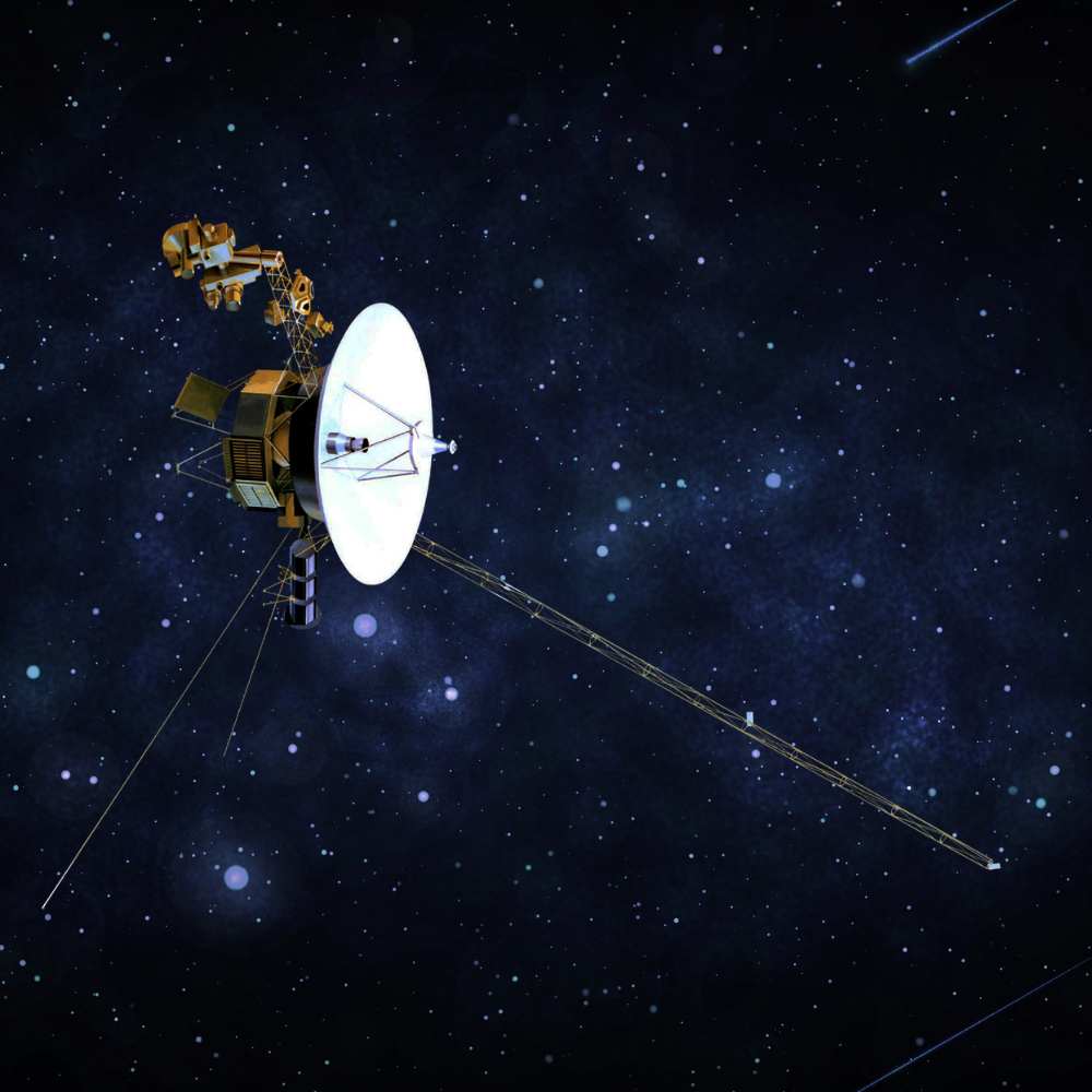 Artist’s illustration of Voyager 1 spacecraft traveling through deep space, carrying its high-gain antenna and scientific instruments as it explores interstellar space beyond the heliosphere.